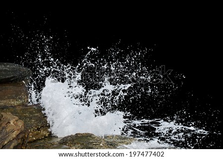 Water wave splashes, isolated on black background Royalty-Free Stock Photo #197477402