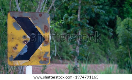 Old and rusty traffic signs in Thailand.