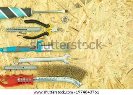Metal brush, screwdriver brush on the table. Background with space for text