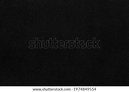 Black polished sandstone wall texture and seamless background