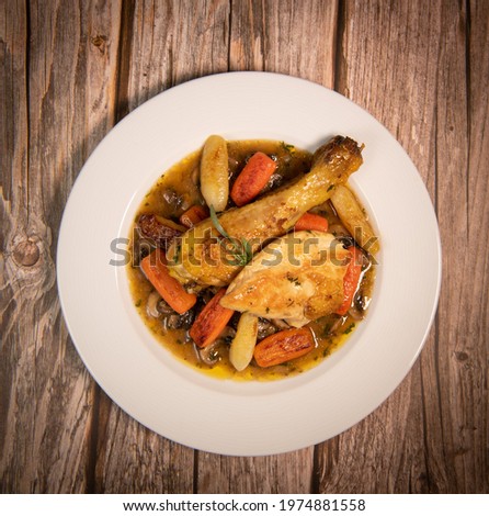 Chicken Hunter recipe with glazed root vegetables, carrot, turnip with its mushroom sauce deglazed in white wine and wet with the chicken stock
