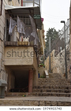 Jerusalem Israel 27 March 2021, pedestrian street of the old city with stone steps and residential buildings. High quality photo