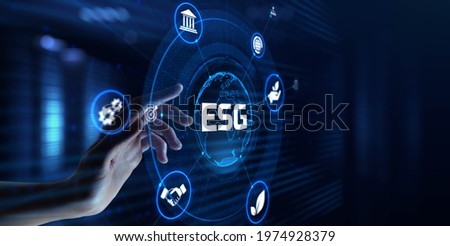 ESG environmental social governance business strategy investing concept. Hand pressing button on screen. Royalty-Free Stock Photo #1974928379