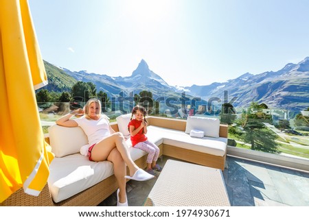 Sunny summer morning in Zermatt village with Matterhorn peak on backgroud. Beautiful outdoor scene in Swiss Alps, Switzerland, Europe.