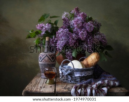 Spring still life with lilac on a setting table
