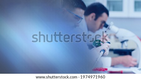 Composition of group of scientists in lab using pipette and microscope with motion blur. science and research technology concept digitally generated image.