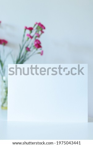 blank a4 paper template with pink carnation flowers