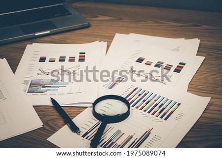 Fundamental and technical analysis for professional technical trading as concept. Digital graph of financial instruments with some indicators including of MACD. EMA and the volume analysis. Royalty-Free Stock Photo #1975089074