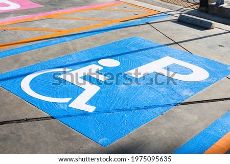handicapped parking space in parking lot.