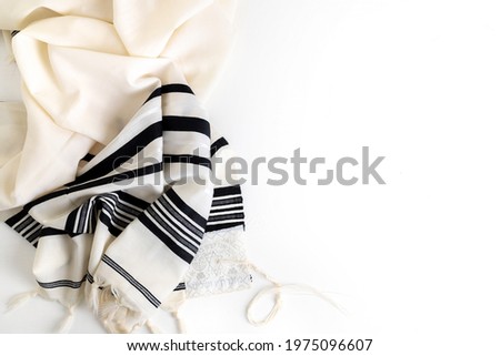 Top view. Religion concept of White Prayer Shawl - Tallit, Jewish religious symbol Royalty-Free Stock Photo #1975096607