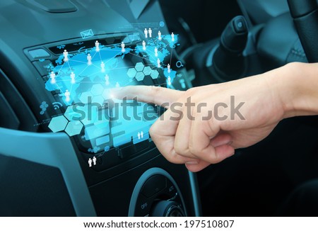 Pushing on a touch screen interface navigation system in interior of modern car