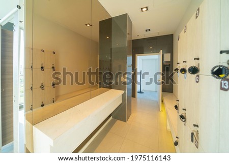 Spa and sauna room with lockers in condominium, modern residential property. An indoor lockers facility service space. Interior design decoration.