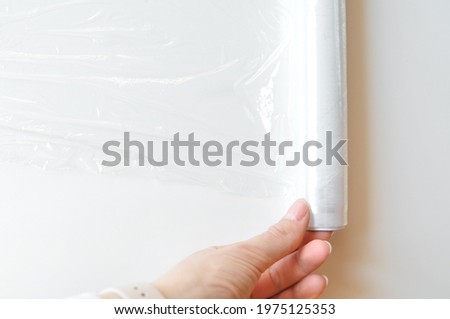 thin and clear plastic wrap on white background 