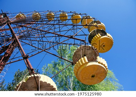ferris wheel in amusement park. the most famous ghost town Pripyat near Chernobyl and Nuclear Power Plant. exclusion zone. Ukraine. Royalty-Free Stock Photo #1975125980