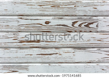 Decorative board background, white worn paint on the board surface. Stock Photo