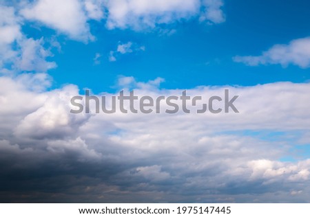 Soft focused Panoramic view of beautiful thunderclouds. Beautiful dramatic  blue sky background. Rainy weather. Soft focus photo.