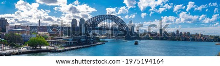 View if Sydney Harbour Picture taken from Cahill Expressway Circular Quay NSW Australia. Ferry boats partly cloudy skies blue waters Royalty-Free Stock Photo #1975194164