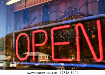 Fluorescent and red OPEN sign