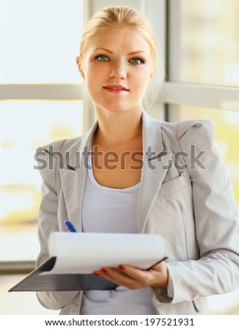Portrait of the business woman with folder ,isolated on white background
