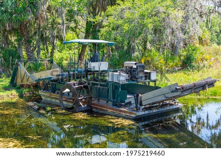 Aquatic weed harvester - Cooter Pond Park, Inverness, Florida, USA Royalty-Free Stock Photo #1975219460