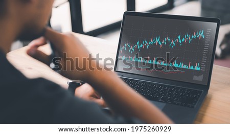 planning and strategy, Stock market, Hands of business people working at modern cafe. Technical price graph and indicator, red and green candlestick chart and stock trading computer screen background.