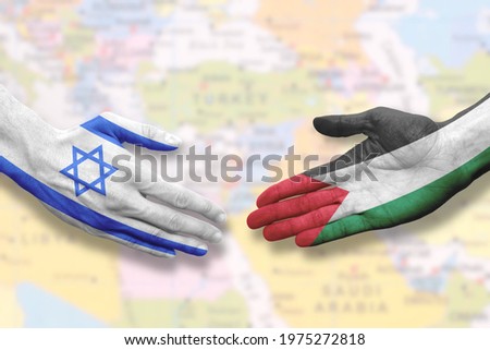 Israel and Palestine - Flag handshake symbolizing peace or agreement Royalty-Free Stock Photo #1975272818