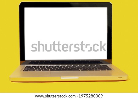 blank screen laptop isolated on yellow background with clipping path