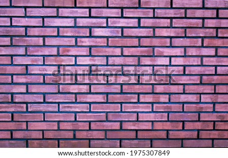 Weathered stained old purple brick wall background