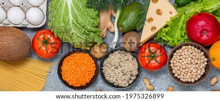 Conceptual image of a balance of healthy food with vegetables and fruits. Nutrition and diet picture with copyspace