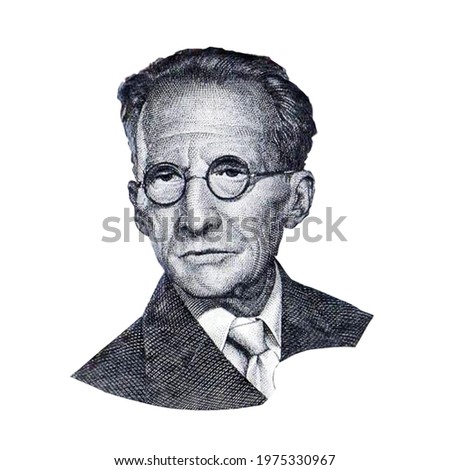 World famous physicist Erwin Schrödinger black and white portrait close up isolated on white background. Fragment of austrian banknote Royalty-Free Stock Photo #1975330967