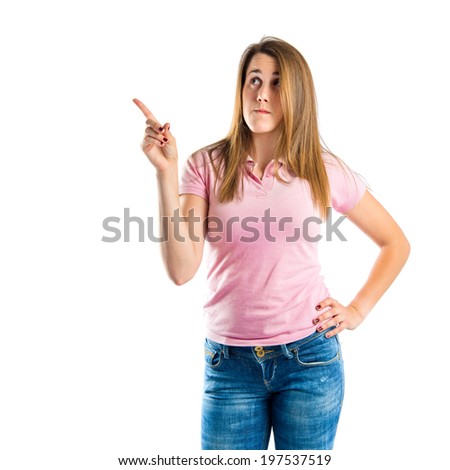 Young girl thinking over isolated white background 