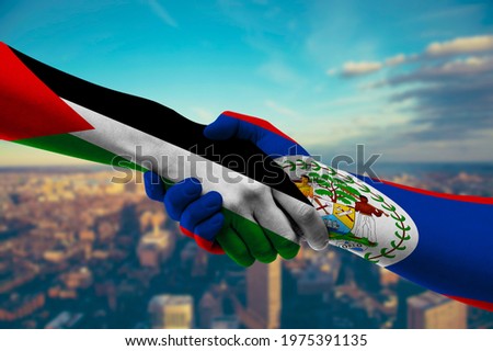 Shaking hands Palestine and Belize