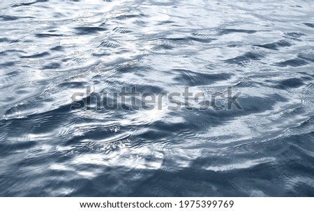  Water surface texture.  Rippled blurred texture of water.
