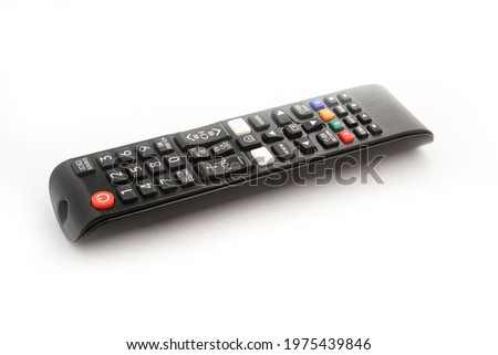 Black television remote control on white background. Technology entertainment media control tool while watching TV, play game, movie, music and media recording while people take relax time in home.