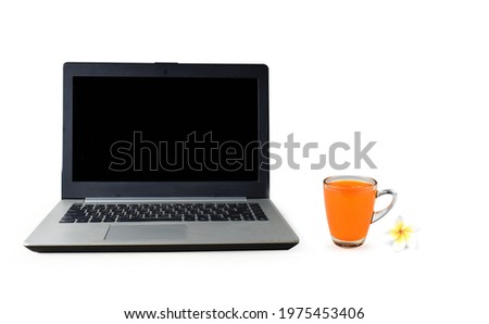 Laptop and orange juice on a white background suitable for presentations