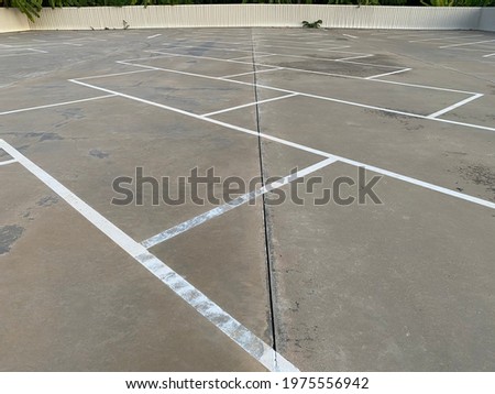 Traffic lines on the concrete floor of the parking lot