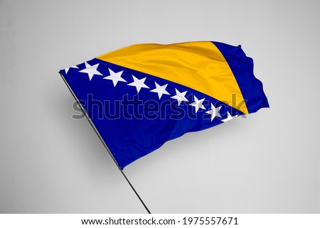 Bosnia and Herzegovina flag isolated on white background with clipping path. close up waving flag of Bosnia and Herzegovina. flag symbols of Bosnia and Herzegovina.