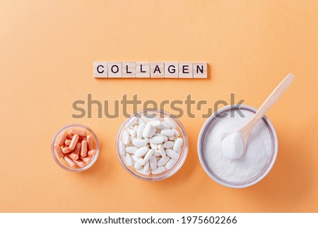 Different types of collagen for skin care flat lay with collagen quote made of wooden blocks Royalty-Free Stock Photo #1975602266