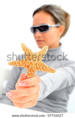 girl with sunglasses and starfish against white