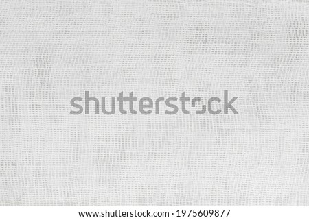 Background Texture of white medical bandage. cheesecloth texture Royalty-Free Stock Photo #1975609877