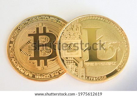photo golden bitcoin and litecoin on white background