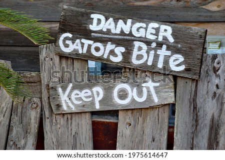 Alligators danger warning sign background