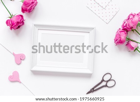 Mother's day gift with peony flowers and frames top view mockup