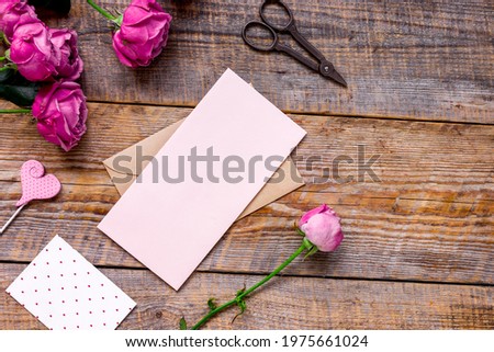 Spring design with peony flower and greeting-card wooden background top view mock-up