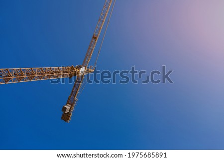 tower crane on the background of the blue sky. copy space
