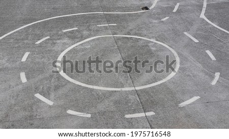 Roundabout  painted white lines on concrete pavement