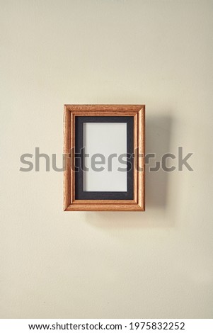 A studio photo of a timber photo frame
