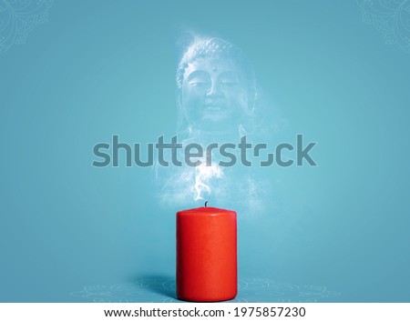Concept of Buddha Purnima. Red candle with smoke buddha on isolated background. Royalty-Free Stock Photo #1975857230