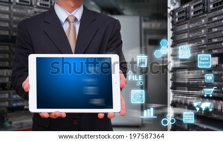 Business man in data center room and icon control