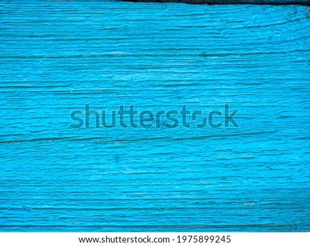 Close-up of a blue-painted board. Old peeling background